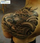 Cool-Black-Ink-Dragon-Tattoo-On-Man-Left-Back-Shoulder.jpg