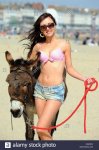 girl-with-donkey-on-british-beach-hot-weather-sunshine-and-people-CA2DKX.jpg