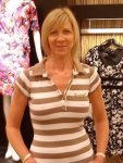 Blonde_mature_woman_in_brown_and_white_striped_top.jpg